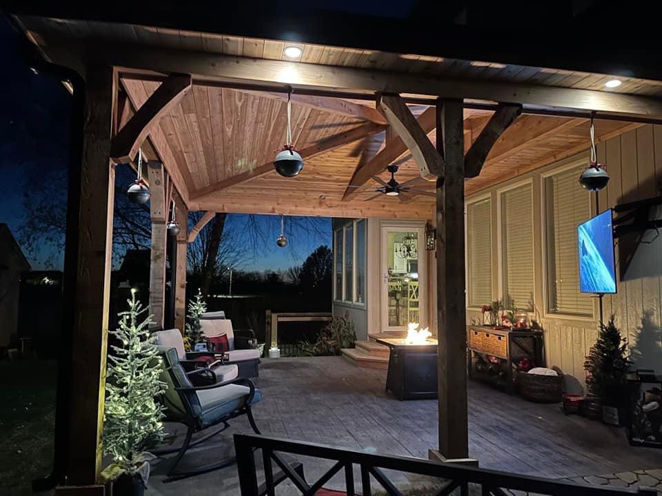 Covered patio with barnwood stamped concrete, accent lighting, ceiling fan and accessory wiring. Fall 2021