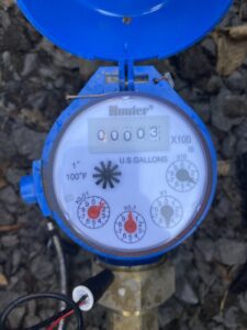 Hunter brand residential irrigation flow meter open to read display numbers